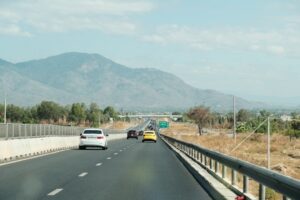 what hybrid car gets the best highway mileage